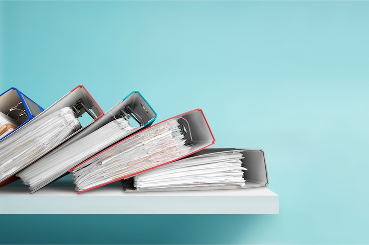 Photo file folders with documents on  background