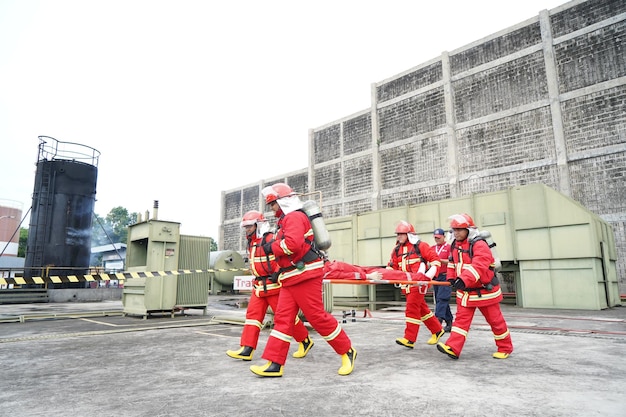 firefighter_rescue_team_training_help_people_from_fire_accident_simulation