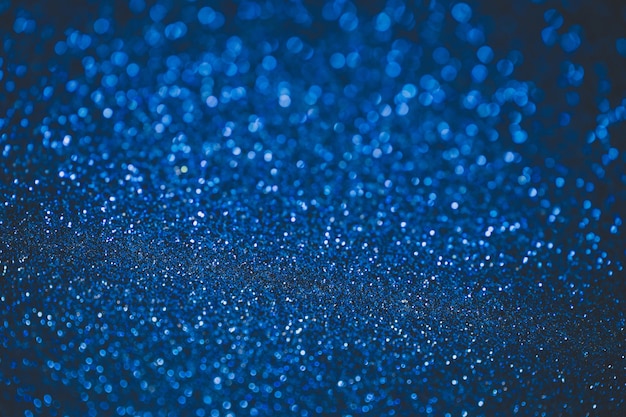 Fondo astratto blu del bokeh. Trama di Natale blu.