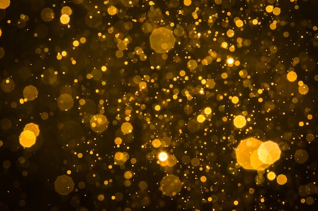 Fondo astratto del bokeh della scintilla dell&#39;oro della sfuocatura