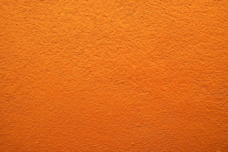 Fondo astratto di struttura della parete di cemento arancione per il disegno