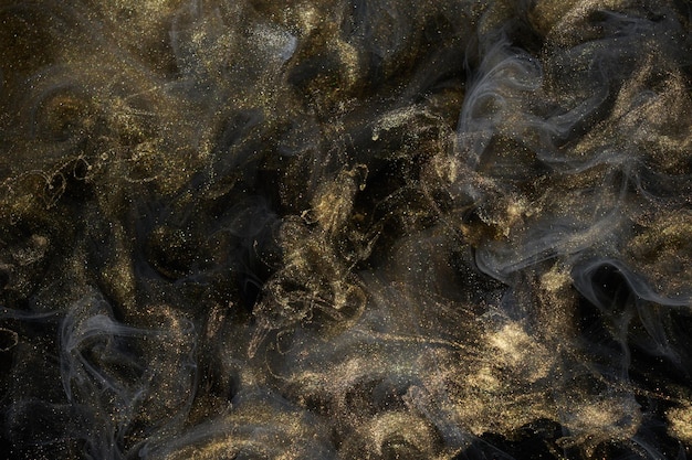 Fondo astratto scintillante dorato lusso nero fumo vernice acrilica esplosione subacquea cosmica inchiostro vorticoso
