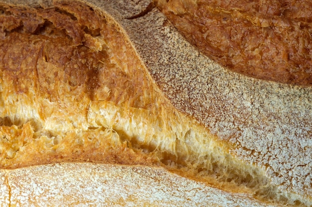 Fondo bianco dell'alimento del primo piano delle baguette del pane di frumento