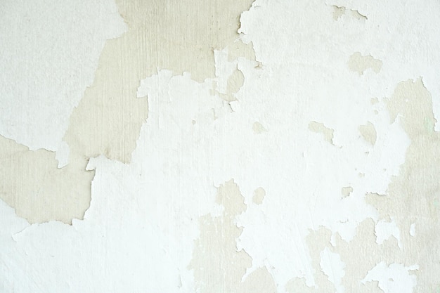 Fondo bianco della parete del cemento con scolorito