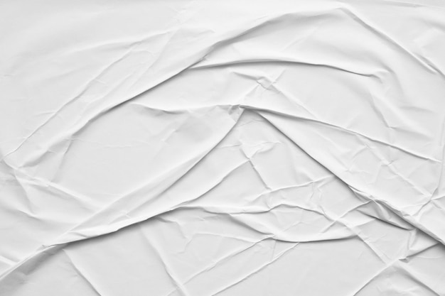 Fondo bianco vuoto di struttura del manifesto di carta stropicciata e sgualcita