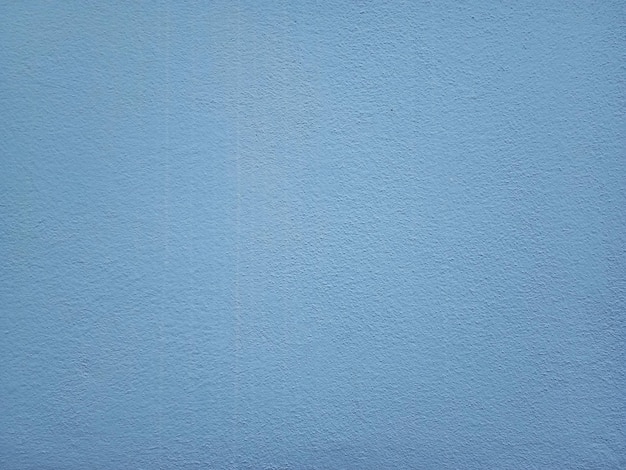 Fondo blu della parete del cemento di superficie liscia