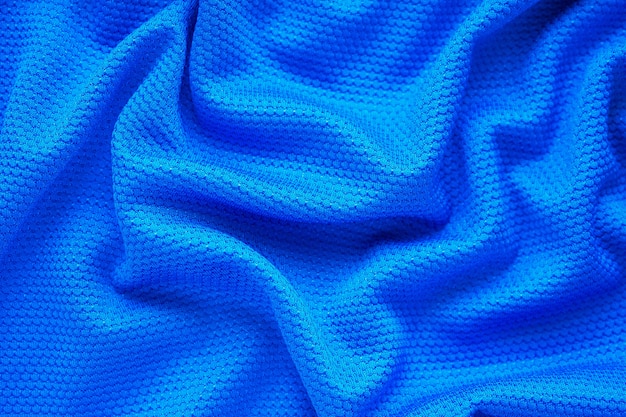 Fondo blu di usura di sport di struttura del tessuto dell'abbigliamento della maglia da calcio