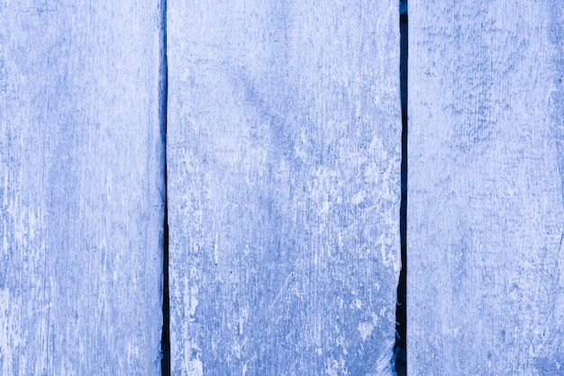 Fondo blu polveroso dei bordi di legno