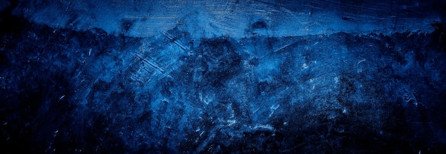 fondo blu scuro del muro di cemento di struttura astratta