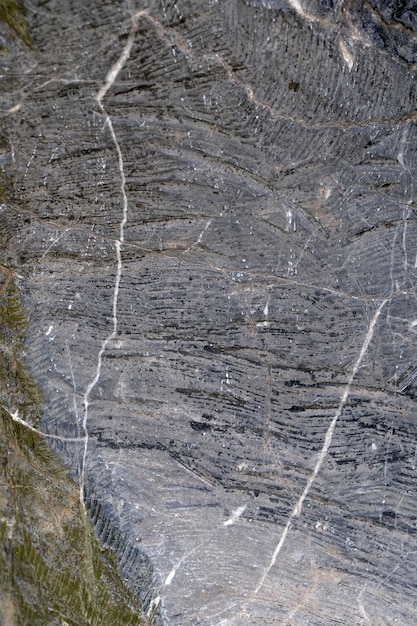 Fondo chiaro incrinato strutturato del granito