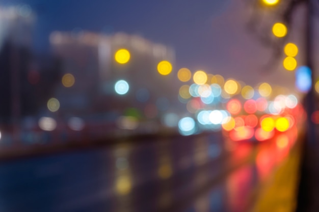 Fondo defocused urbano astratto del bokeh della luce notturna