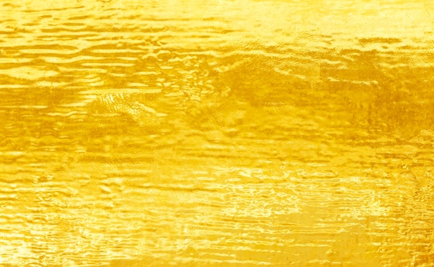 Fondo dell'estratto di struttura d'acciaio del metallo lucidato oro.