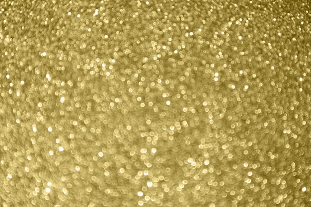 Fondo della luce del bokeh della scintilla astratta di scintillio dell'oro