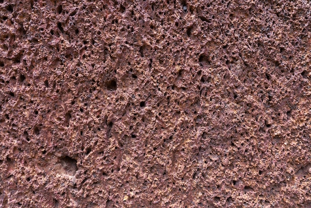 Fondo della struttura rossa della parete di pietra della laterite
