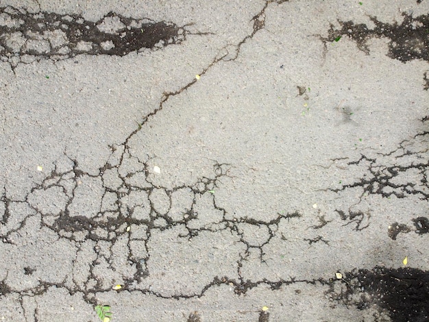 Fondo di asfalto con struttura incrinata