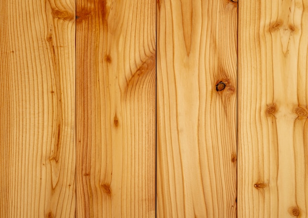 Fondo di legno giallo di struttura del primo piano. Struttura di legno con un modello unico.