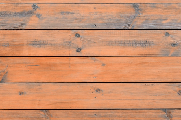 Fondo di legno verniciato dall'esterno della cabina. Plancia di legno marrone del granaio