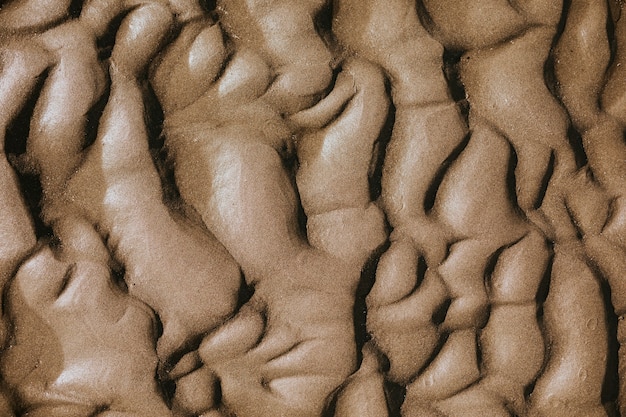 Fondo di struttura dell'onda della sabbia della spiaggia Beach