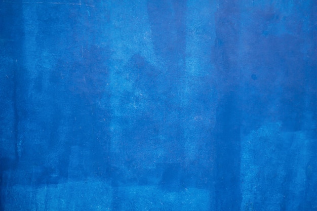 Fondo e struttura blu della parete della pittura