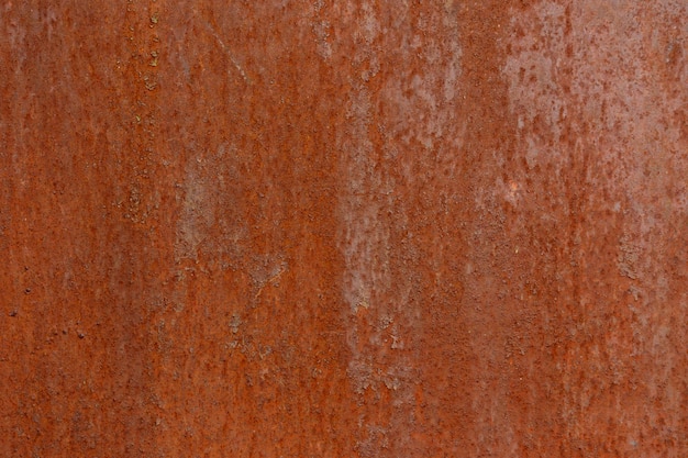 Fondo e struttura del primo piano della superficie del ferro arrugginito rosso asciutto piatto