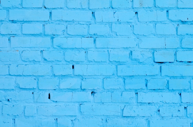 Fondo e struttura quadrati della parete del blocchetto del mattone