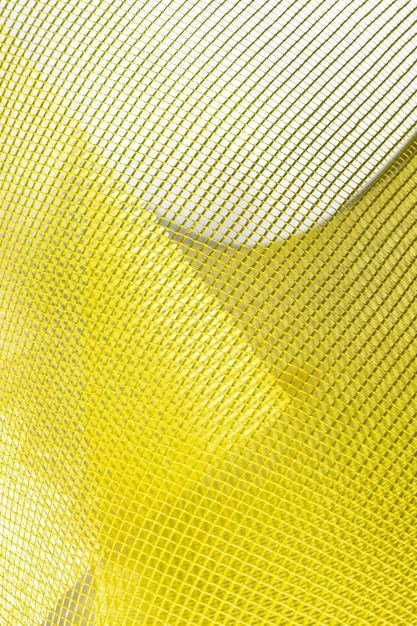 Fondo giallo astratto della maglia, per la decorazione, per il disegno, per il modello