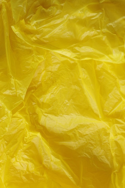 Fondo giallo di struttura del sacchetto di plastica