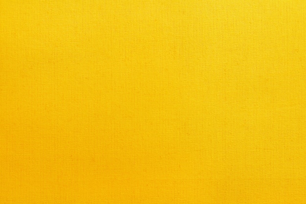 Fondo giallo dorato di struttura del tessuto di cotone