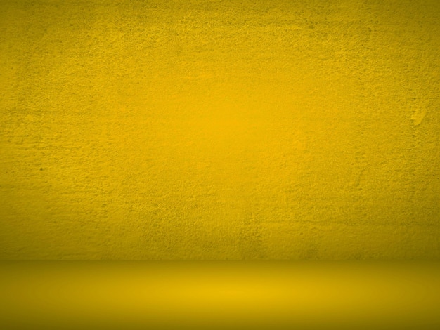 Fondo giallo liscio astratto della stanza dello studio utilizzato per la visualizzazione del prodotto, il banner, il modello