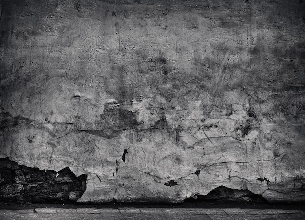 Fondo nero del primo piano di struttura del calcestruzzo incrinato