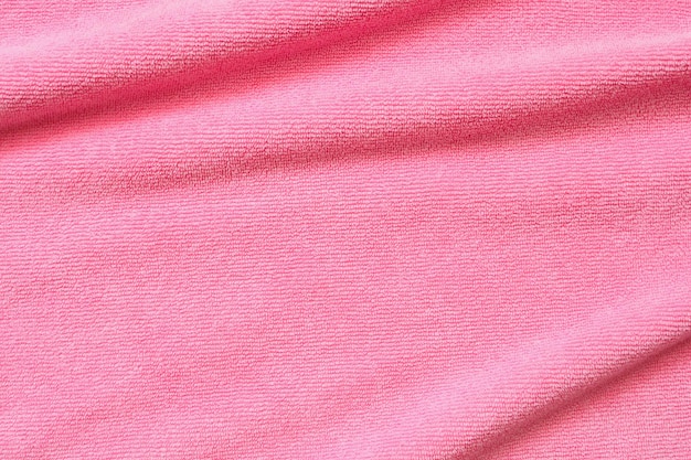 Fondo rosa di struttura della superficie del tessuto dell'asciugamano