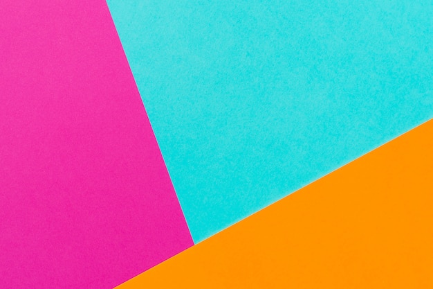 Fondo rosa ed arancio blu astratto nella composizione nella geometria della carta di colore. Copia spazio. Spazio libero per il testo.