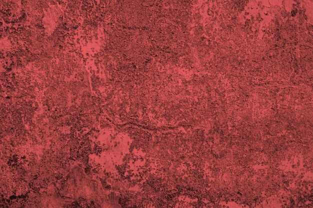 Fondo rosso dell'estratto del muro di cemento di lerciume