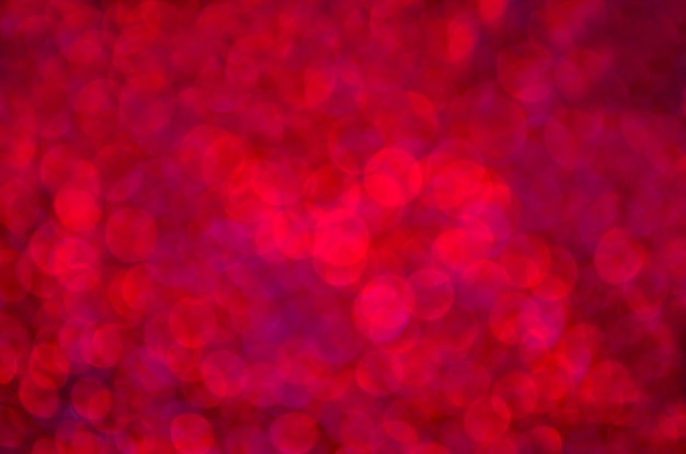 Fondo rosso di scintillio di festa del bokeh