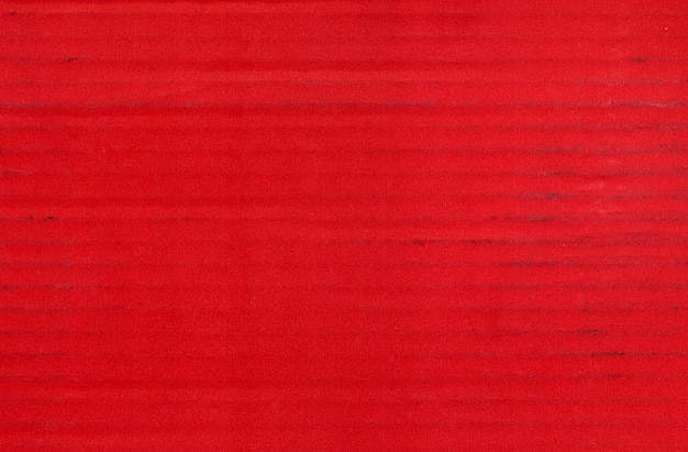 Fondo rosso di struttura del cartone ondulato