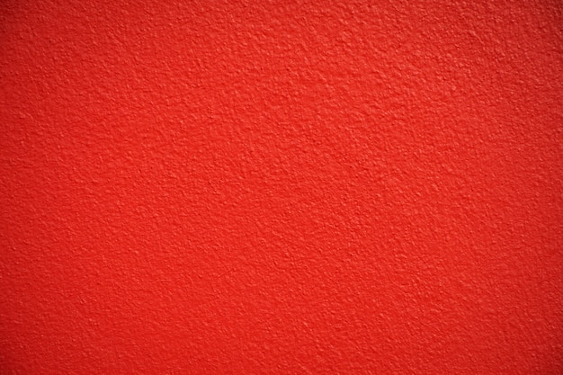 Fondo rosso di struttura del muro di cemento.