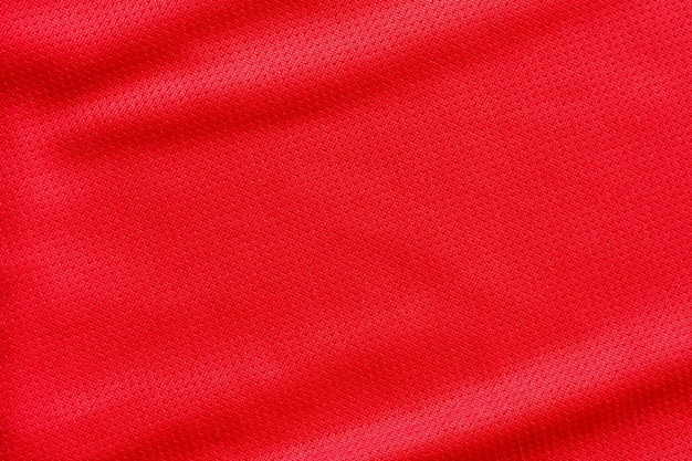 Fondo rosso di struttura della maglia della maglia di calcio del tessuto dell'abbigliamento sportivo