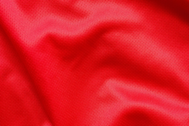 Fondo rosso di struttura della maglia della maglia di calcio del tessuto dell'abbigliamento sportivo