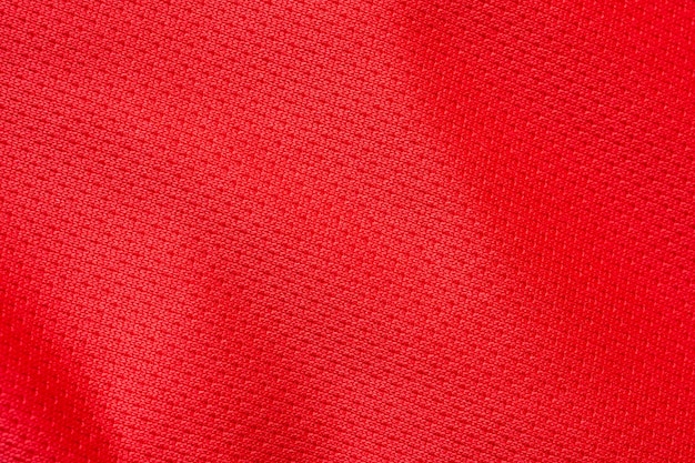 Fondo rosso di struttura della maglia della maglia di calcio del tessuto dell'abbigliamento sportivo