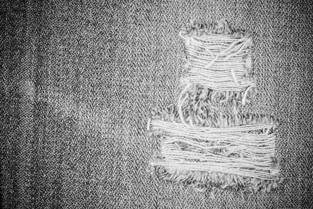 Fondo strappato di struttura dei jeans.