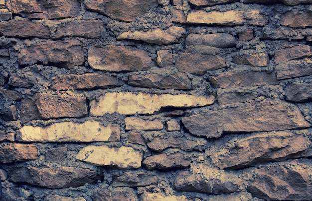 Fondo strutturato del muro di pietra Stone