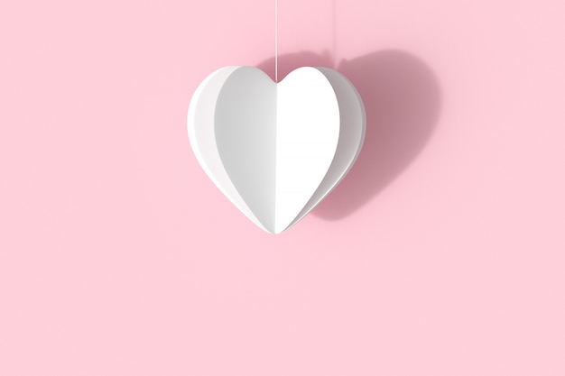 Forma di cuore bianco su sfondo rosa pastello. idea di concetto di San Valentino minimale.