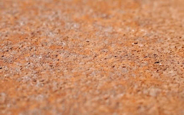 Foto macro di superficie di metallo arrugginito, vecchio fondo ruvido di struttura. Messa a fuoco selettiva al centro del telaio.