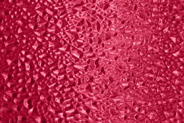 Fotografia sfocata di texture di vetro colorato in rosso trendy del 2023