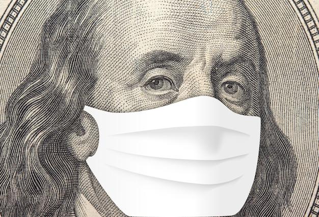 Franklin su una banconota da cento dollari. Concetto di pandemia di coronavirus