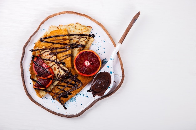 Frittelle con arancia rossa e cioccolato