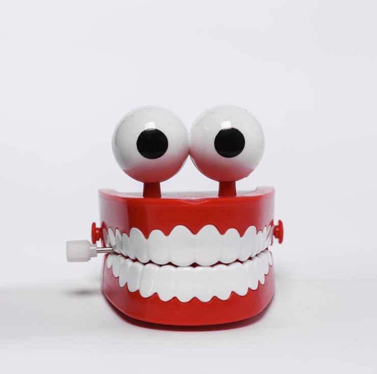 Funny joke clockwork jaw isolated on white background
