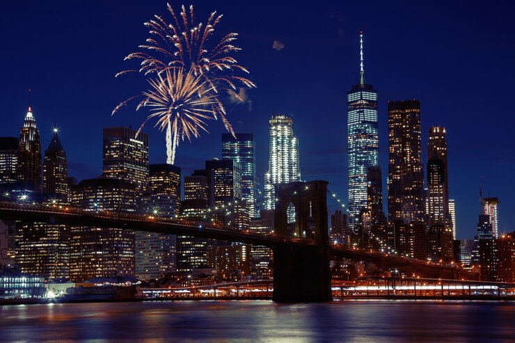 Foto fuochi d&#39;artificio sopra l&#39;orizzonte di new york city e il ponte di brooklyn