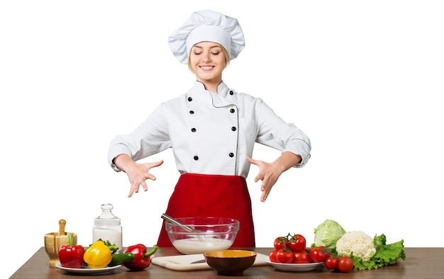 Giovane bella donna che cucina l'uniforme dell'orecchio isolata su white