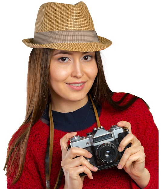 Giovane donna allegra con la macchina fotografica